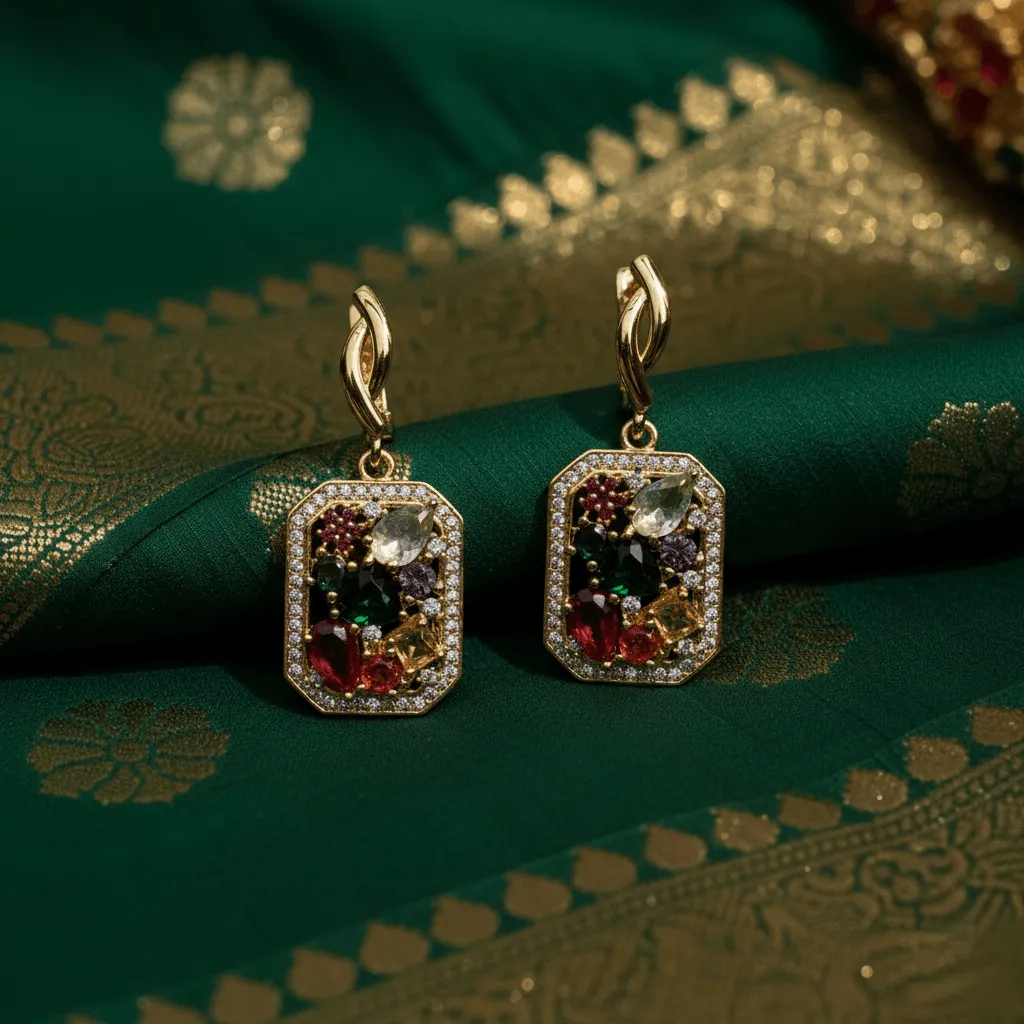 A pair of statement earrings resting on the rich texture of a silk sari.