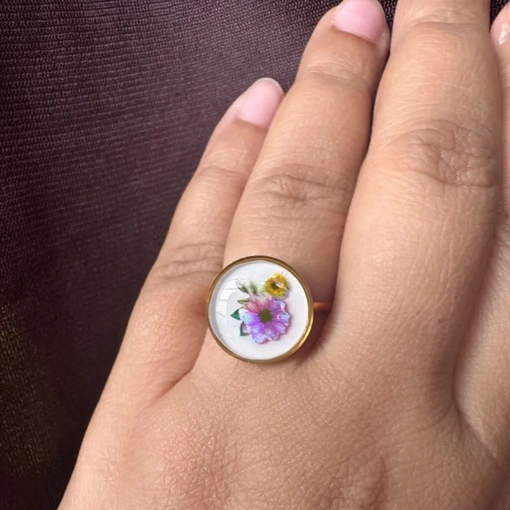 The Lunara Ring on a model's hand, resting beautifully on a love letter